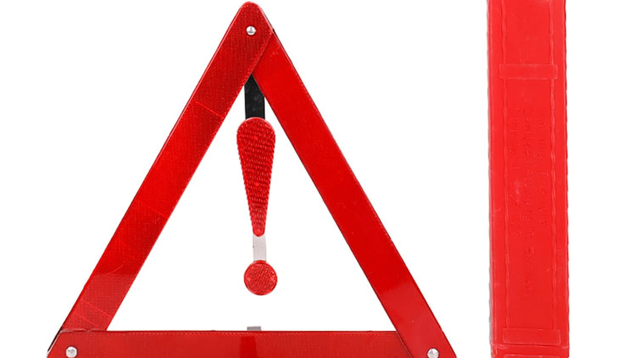 blue bowl of black bean beef tortilla soup on a board with cilantro and shredded cheese in background