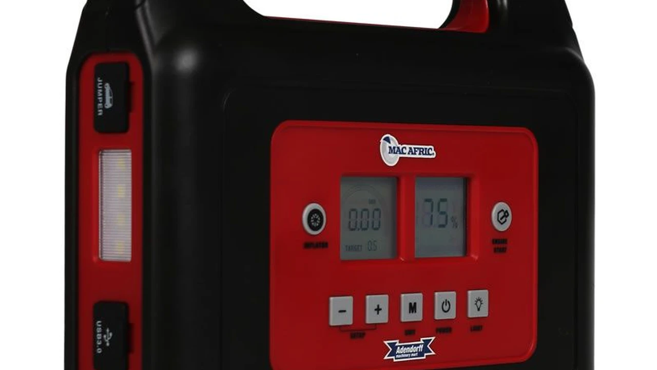 blue bowl of black bean beef tortilla soup on a board with cilantro and shredded cheese in background