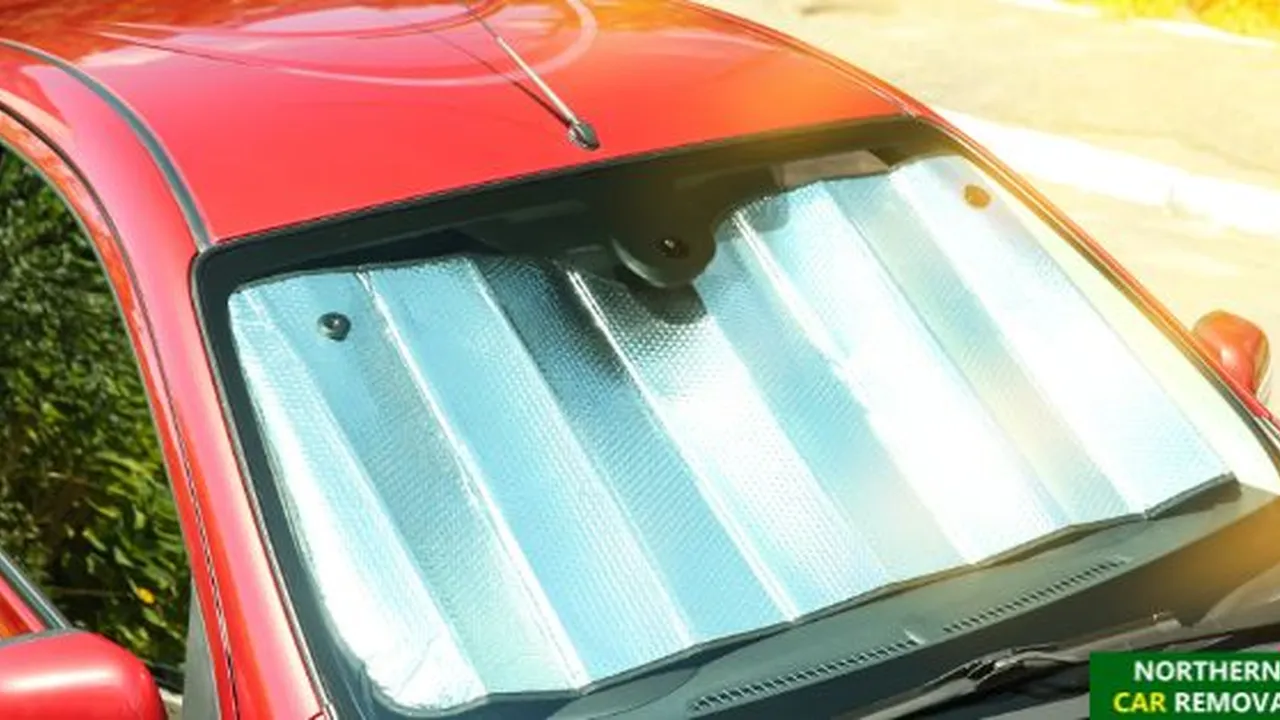 blue bowl of black bean beef tortilla soup on a board with cilantro and shredded cheese in background