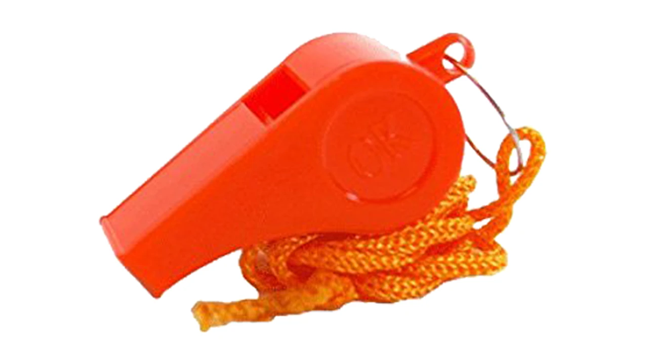 blue bowl of black bean beef tortilla soup on a board with cilantro and shredded cheese in background